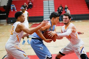 Sean Patrick (left) and Kent Lambert put pressure on a Bullard player.